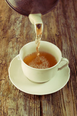tea pour cup pot wooden table cafe instagram filter tint
