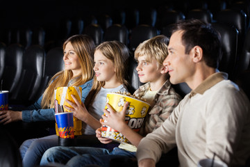 Family Watching Film In Theater