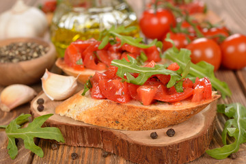 Bruschetta with tomatoes and arugula