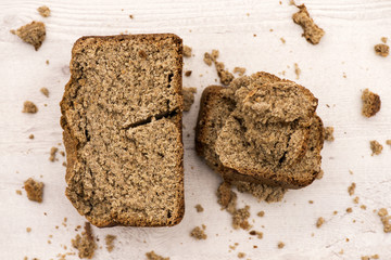 whole grain  buckwheat bread on white wooden background, homemad