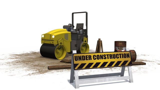 under construction sign and road building machine roller