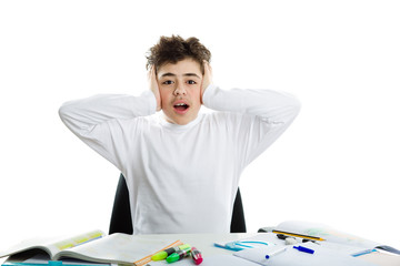 Boy on homework holding head with hands