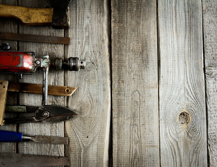 Various tools on a wooden background.