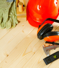 Many working tools on a wooden background.