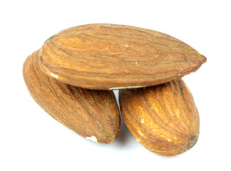 Composition from almond nuts isolated on white background