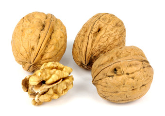 walnut and a cracked walnut isolated on the white background