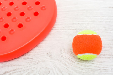 paddle tennis racket and ball