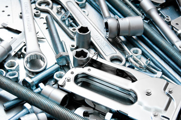 Many tools on the scratched metal background.