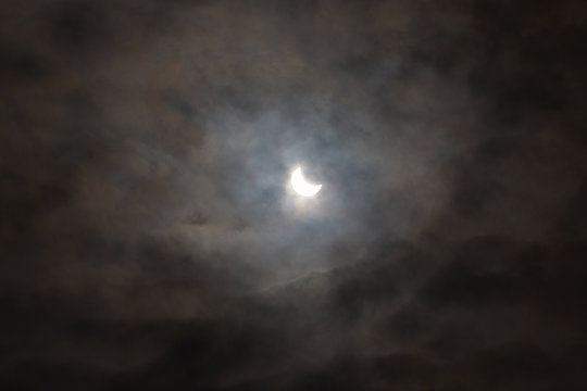 Sun eclipse with dark cloudy sky, mystery