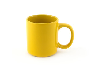 Big empty yellow tea or coffee cup isolated on white close up