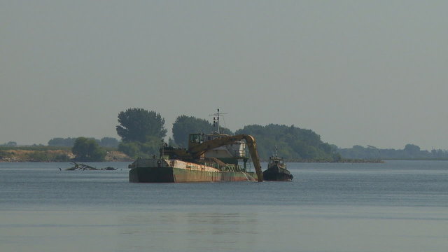 Sand extraction in river boat