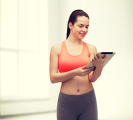 sporty woman with tablet pc computer