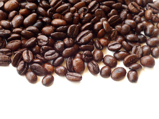 Brown coffee beans isolated on white background