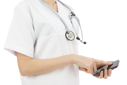 Woman doctor browsing on smart phone