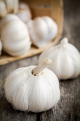 organic garlic bulbs close up on a wooden background