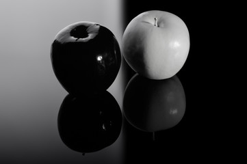 Black apple and white apple.