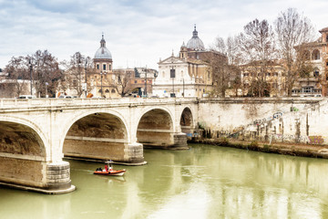 Bridge over the Tiber river in the center of Rome