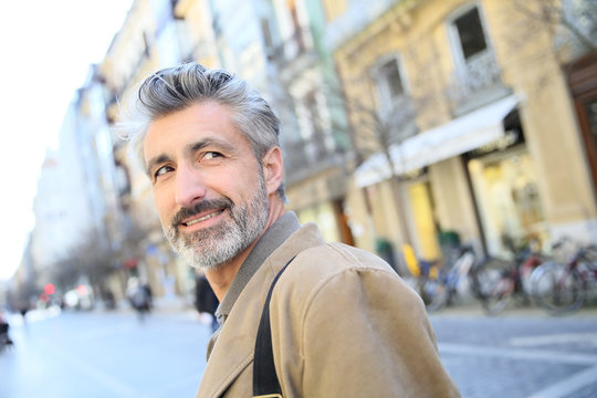 Handsome Mature Man Walking In Town