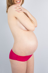 Pregnant Woman holding her hands on her stomach