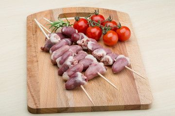 Raw chicken hearts for barbecue