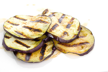 Some fried slices of eggplant isolated on white