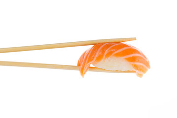Sushi nigiri with chopsticks isolated on white