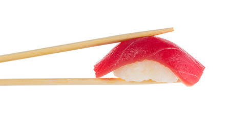 Sushi nigiri with chopsticks isolated on white