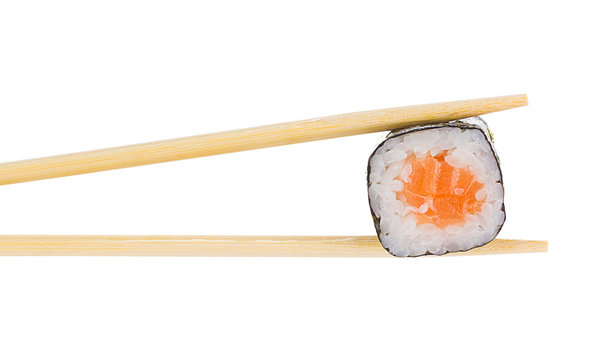 Sushi roll with chopsticks isolated on white