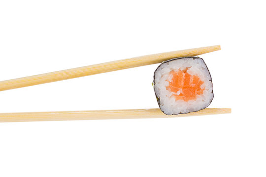Sushi roll with chopsticks isolated on white