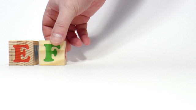 The video shows effort word built of wooden blocks