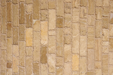 Brown  stone vertical slabs on wall