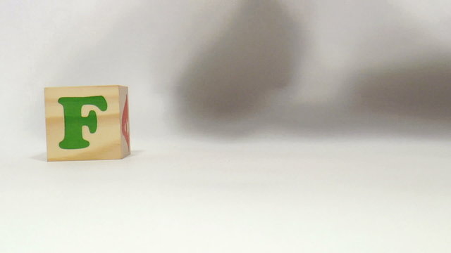 The video shows food word built of wooden blocks