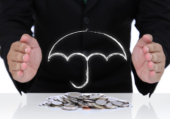Businessman hand protect money with white umbrella sign for safe