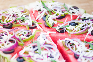 Watermelon pizza on wood