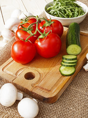 cucumbers, tomatoes, mushrooms and arugula