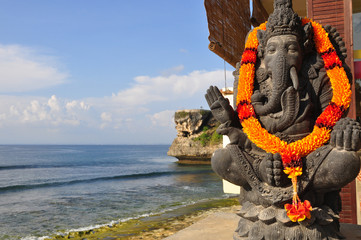 Traditional Balinese God statue, at Ocean, Bali, Indonesia.
