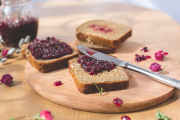 Fresh baked homemade healthy bread blackcurrant jam breakfast
