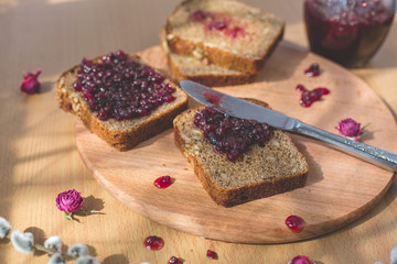 Fresh baked homemade healthy bread blackcurrant jam breakfast