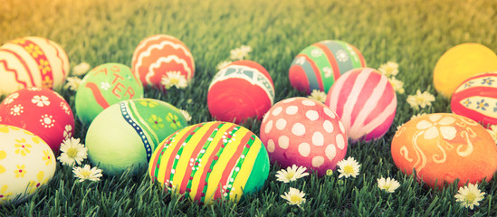 Easter Eggs with flower on Fresh Green Grass ( Filtered image pr