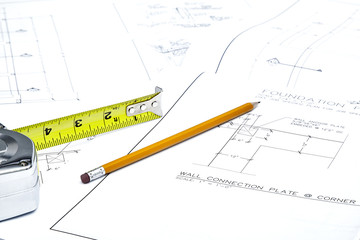 Blueprints with Tape Measure and a Pencil