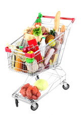 Shopping cart full with various groceries isolated on white © Africa Studio