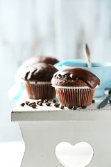 Tasty homemade chocolate muffins and cup of coffee