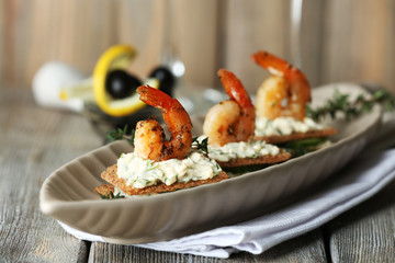 Appetizer canape with shrimp and cucumber