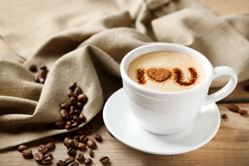 Cup of coffee on old wooden table