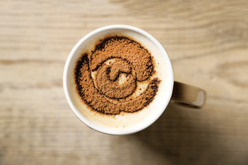 Cup of coffee on old wooden table
