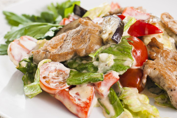 Meat with vegetables and herbs.