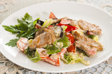 Meat with vegetables and herbs.