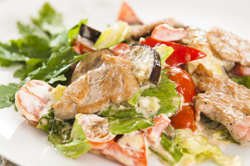 Meat with vegetables and herbs.