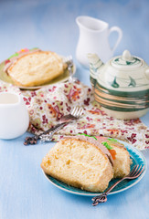 Slices of sponge cake with buttercream on plate