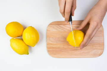Cutting Lemons on a Wooden Cutting Board